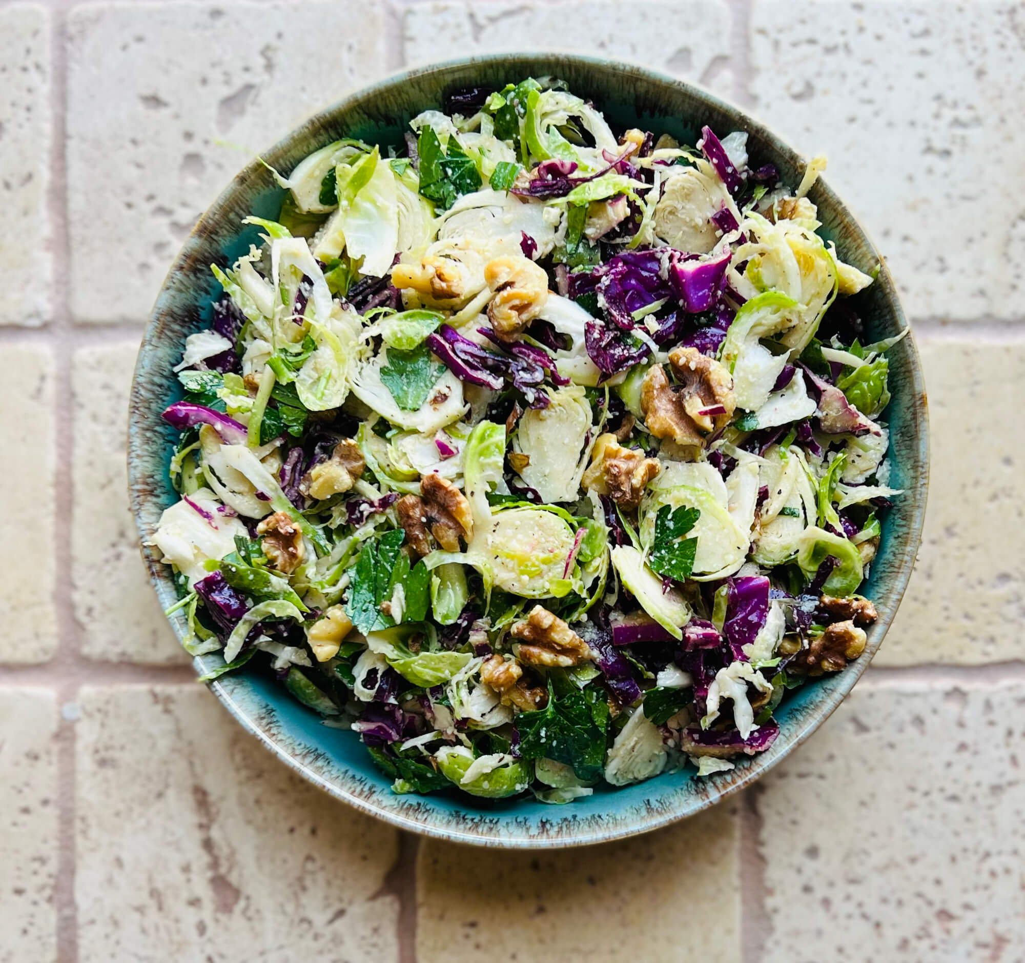 Shredded Brussels Sprouts And Red Cabbage With Walnuts And Parmesan