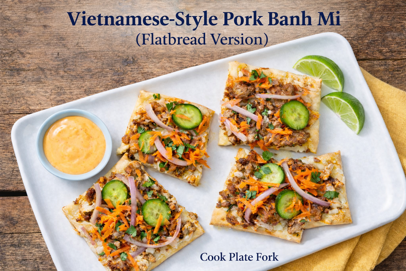 Vietnamese-Style Pork Banh Mi Flatbread with ground pork, pickled vegetables, cucumber, and sriracha mayo on a white plate